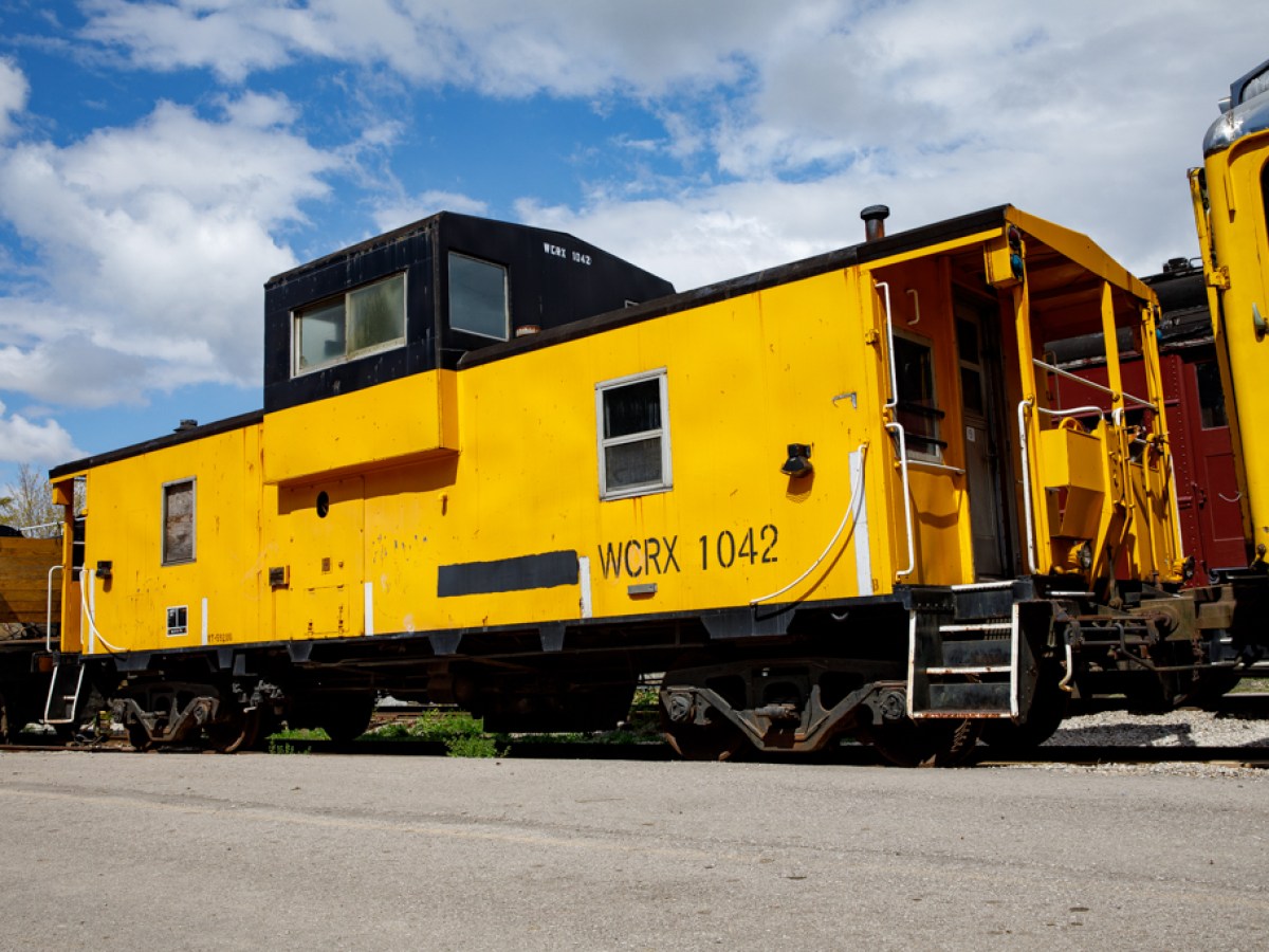 a train that is sitting on a track with Illinois Railway Museum in the background