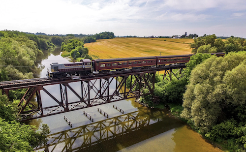 a train crossing a bridge over a river