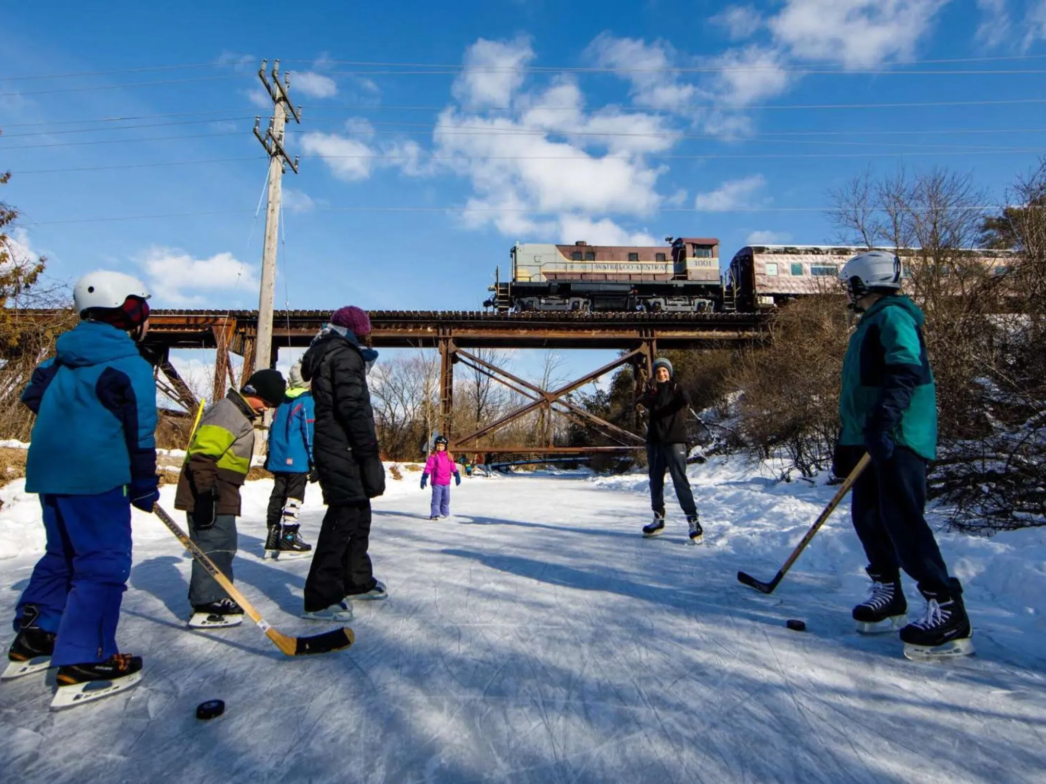 a group of people riding skis on top of a snow covered slope