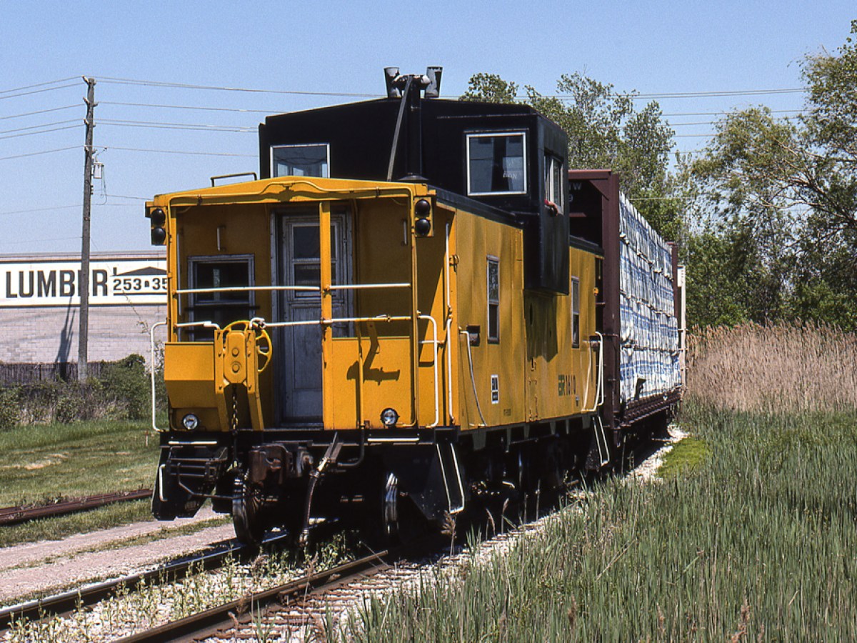 a train that is sitting in the grass