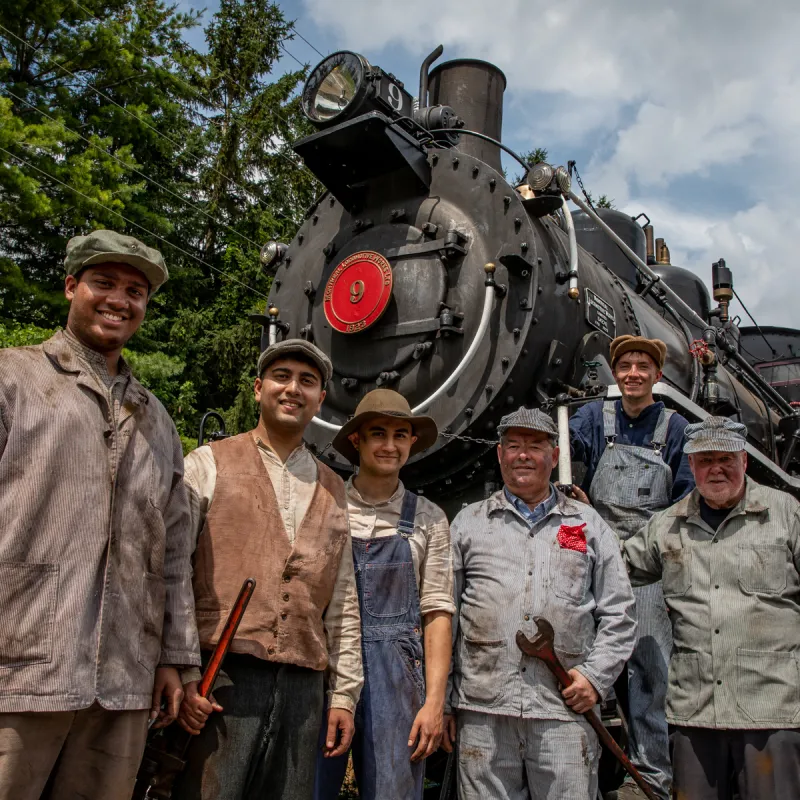 a group of people standing in front of a military man