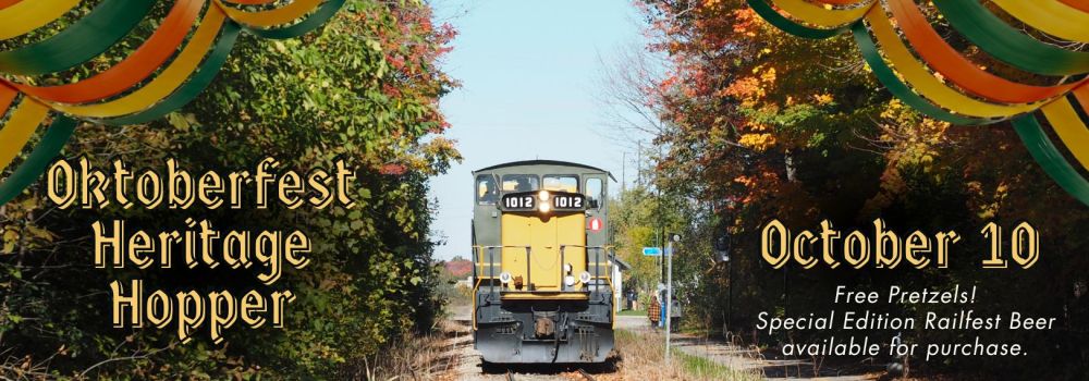 Train on tracks with Oktoberfest decorations, text about event on October 10.