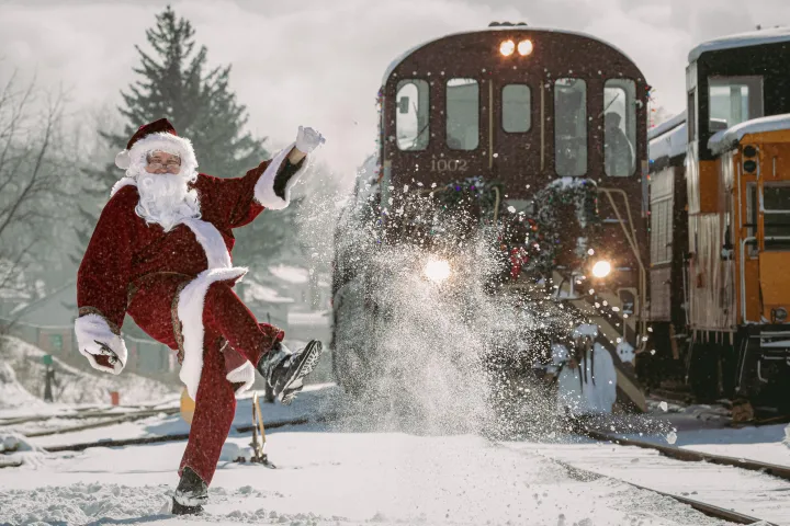 a group of people riding skis on top of a bus