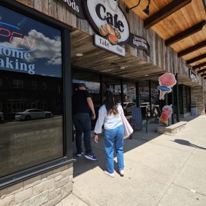 a man standing on a sidewalk