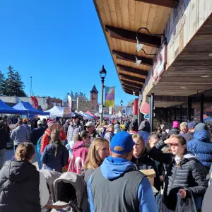 a group of people standing in front of a crowd