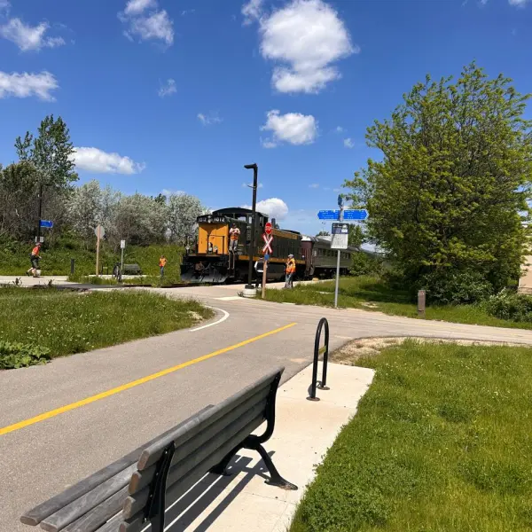 a train is parked on the side of a road