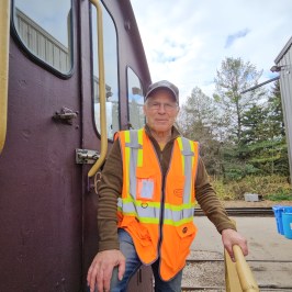 a man standing in front of a building