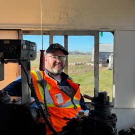 a man riding on the back of a truck