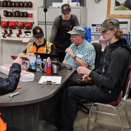 a group of people sitting at a table