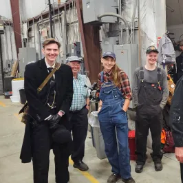 a group of people posing for the camera