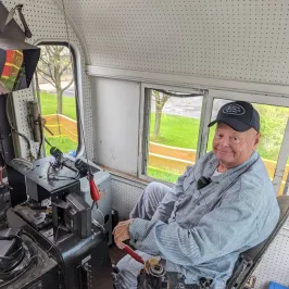 a person sitting on a motorcycle