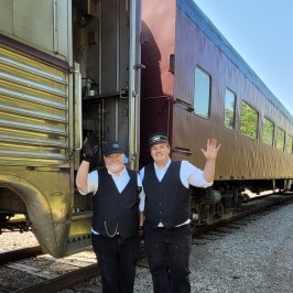 a person standing next to a train