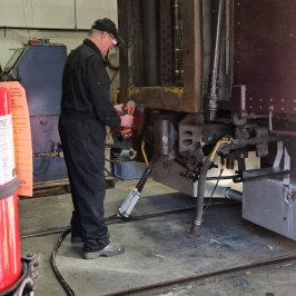 a man holding a bag of luggage