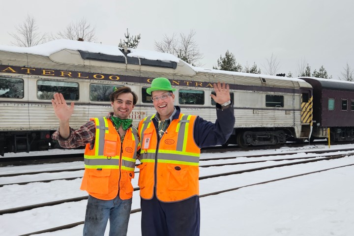 a person standing in front of a train