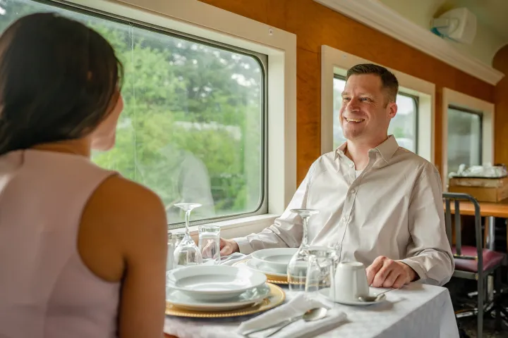 a couple of people sitting at a table