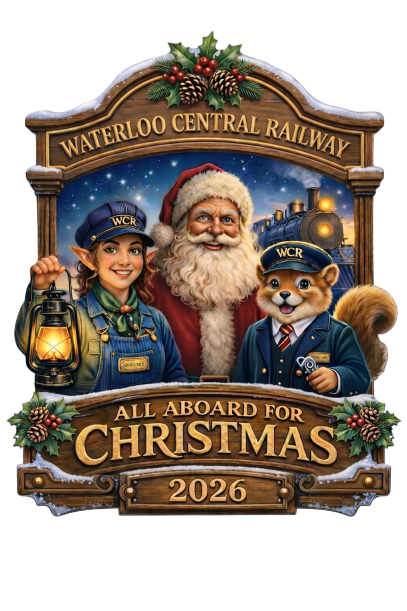 Santa, an elf, and a fox in railway uniforms with Christmas decorations and 'Waterloo Central Railway 2026' sign.